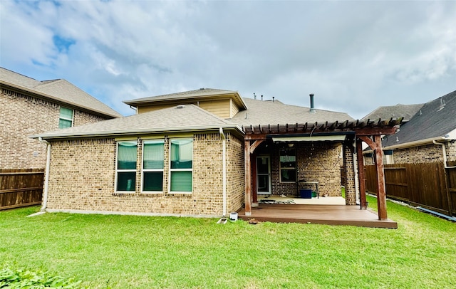 back of property with a patio, a pergola, and a yard