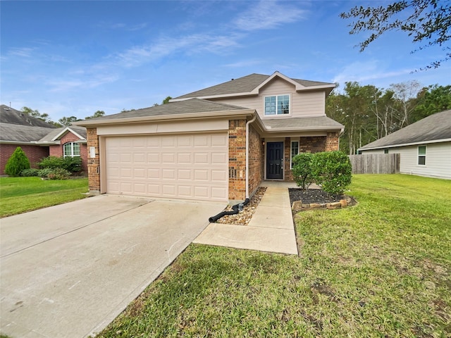 view of front of property featuring a front yard and a garage