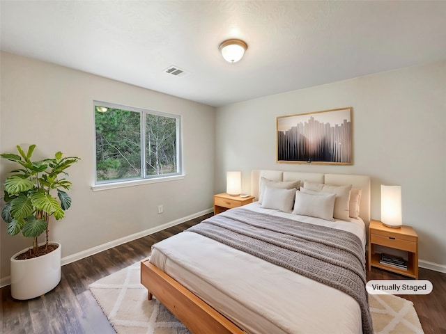 bedroom featuring dark hardwood / wood-style floors