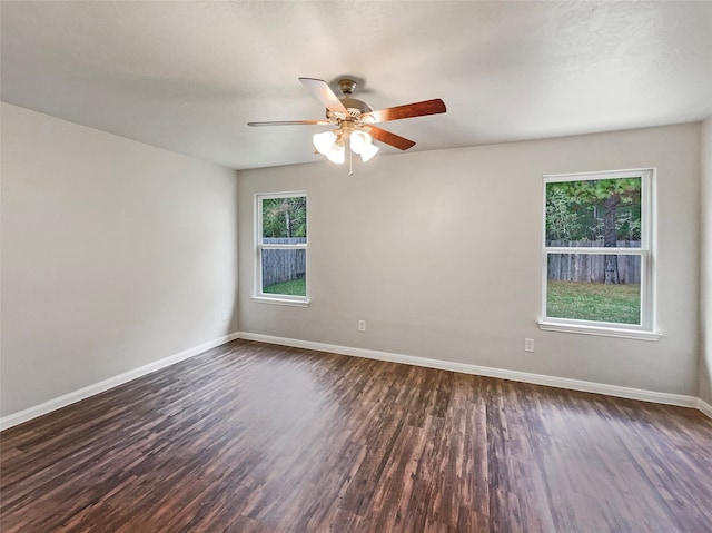 unfurnished room featuring dark hardwood / wood-style floors and ceiling fan