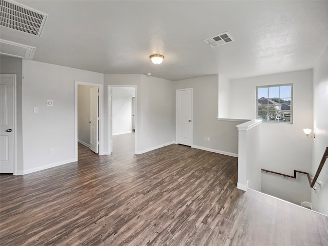 empty room featuring dark hardwood / wood-style flooring