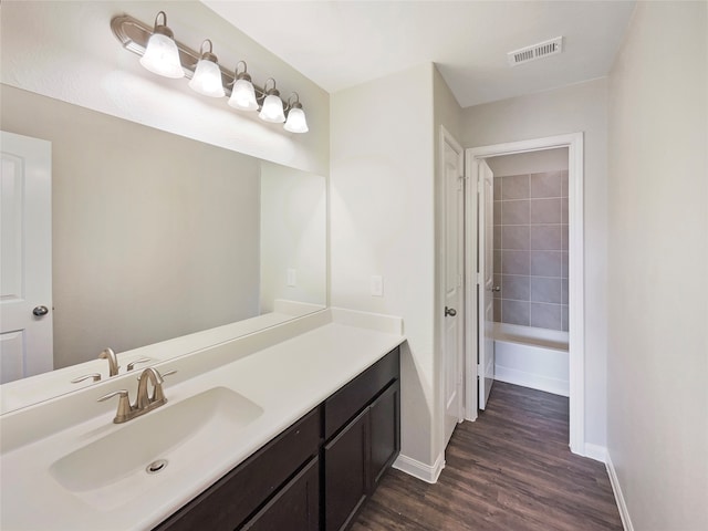 bathroom featuring hardwood / wood-style floors and vanity