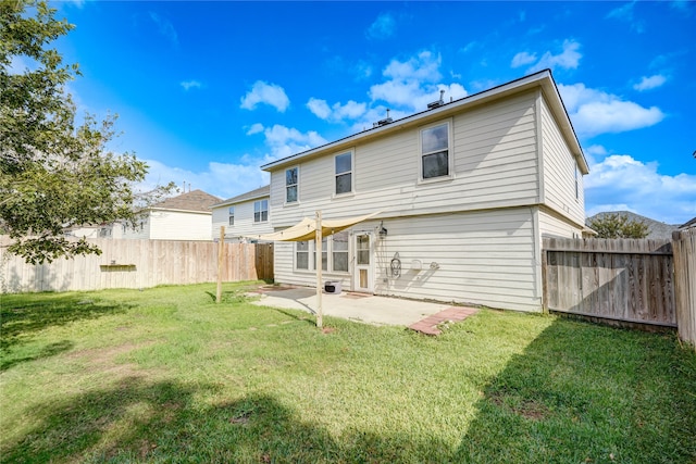 rear view of property with a patio and a yard