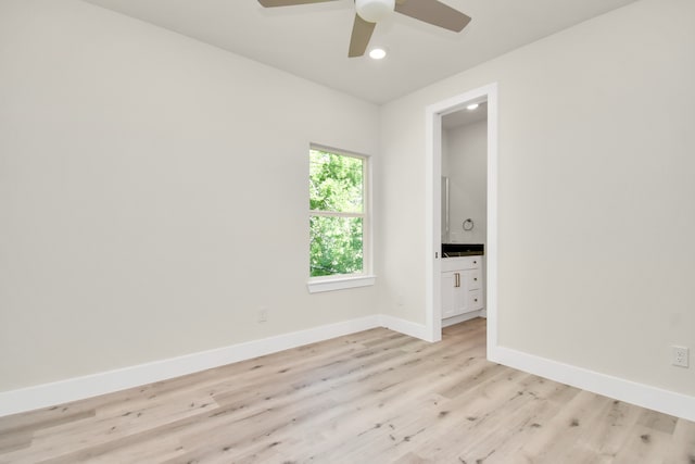 spare room with ceiling fan and light hardwood / wood-style flooring