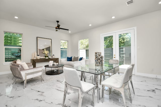 dining space with a healthy amount of sunlight and ceiling fan