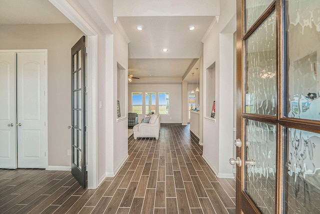 corridor with french doors and dark hardwood / wood-style flooring