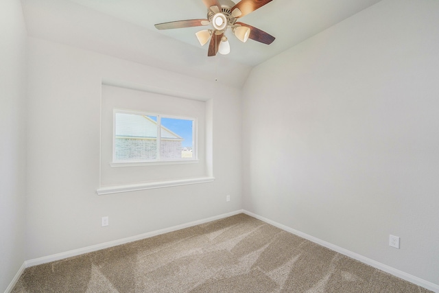 unfurnished room featuring ceiling fan, carpet flooring, and lofted ceiling