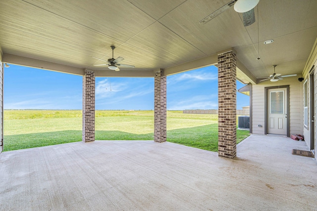 view of patio with a rural view and ceiling fan