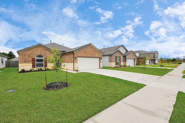 view of front of home featuring a garage and a front lawn