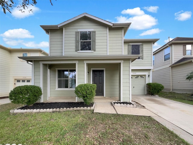 front facade with a front lawn, a garage, and covered porch