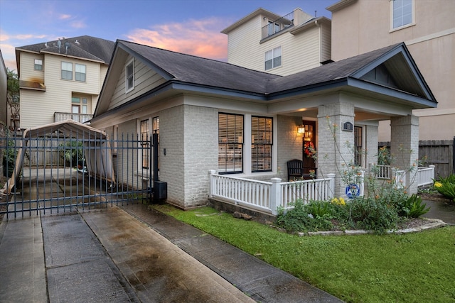 exterior space with a porch and a yard