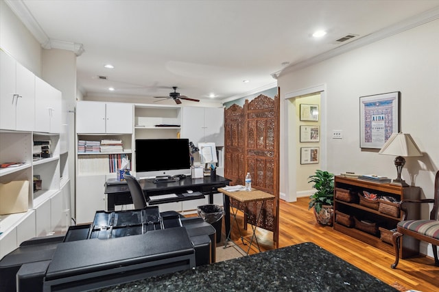 office area with ceiling fan, light wood-type flooring, and crown molding