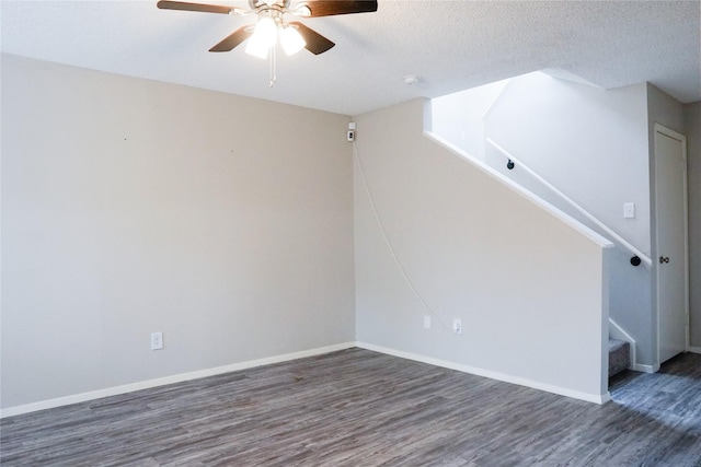 12004B Mighty Oak Dr, Houston, TX 77066 - spare room featuring baseboards, a ceiling fan, wood finished floors, and stairway