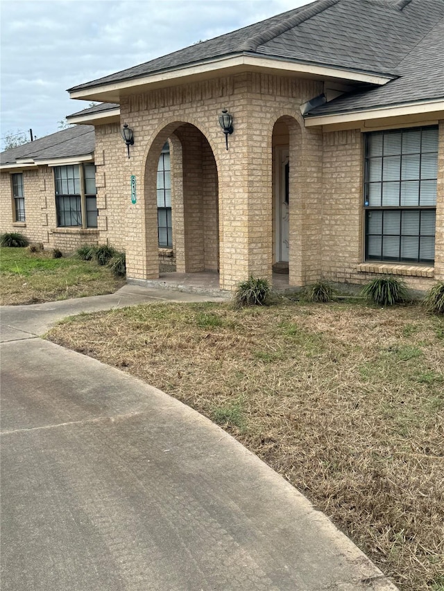 617 County Road 99, Alvin, TX 77511 - entrance to property with brick siding and a shingled roof