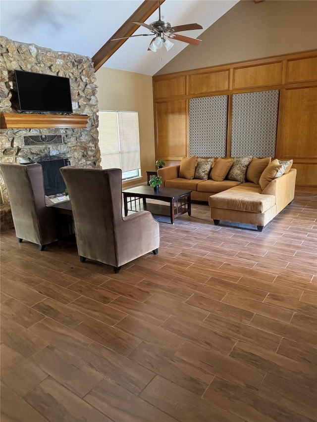 617 County Road 99, Alvin, TX 77511 - living area featuring ceiling fan, beamed ceiling, high vaulted ceiling, wood finished floors, and a stone fireplace