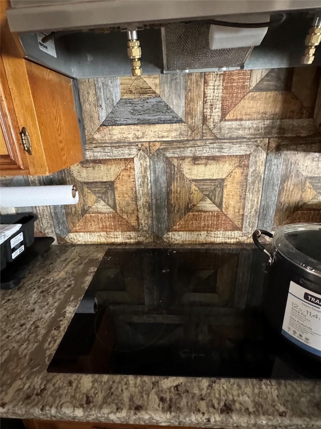 617 County Road 99, Alvin, TX 77511 - kitchen view of brown cabinetry and stovetop