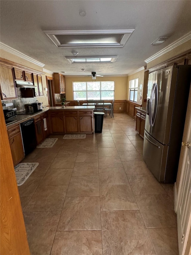 kitchen featuring kitchen peninsula, stainless steel fridge with ice dispenser, black dishwasher, and ornamental molding