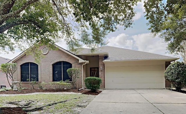 single story home with a garage