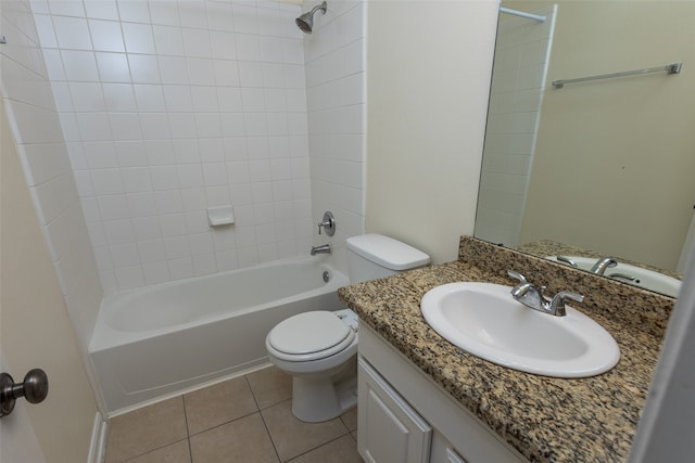 full bathroom with tile patterned flooring, vanity, toilet, and tiled shower / bath