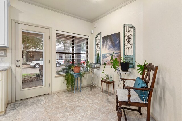 interior space with light tile patterned floors and crown molding