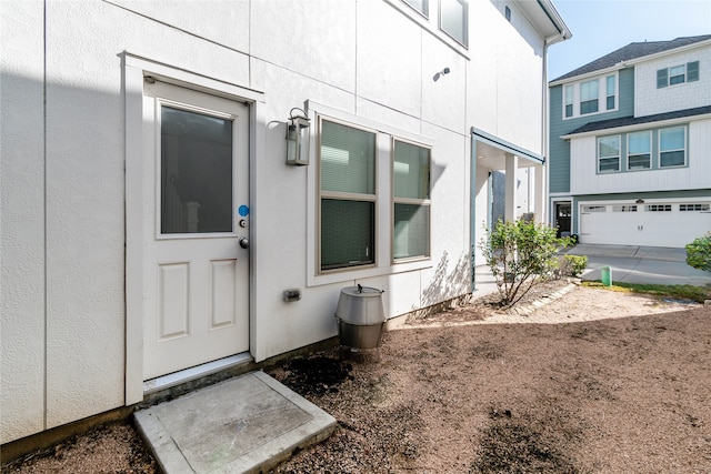 doorway to property featuring a garage