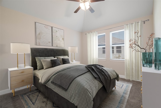 carpeted bedroom with ceiling fan and vaulted ceiling