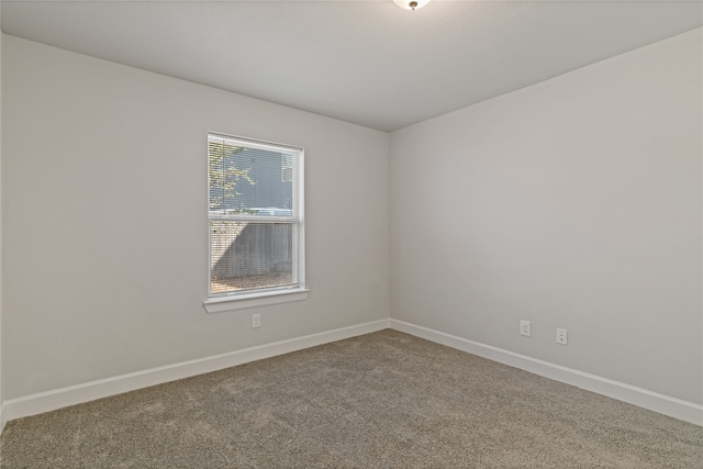 empty room with carpet flooring