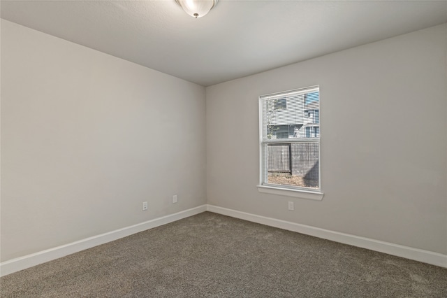 unfurnished room featuring carpet