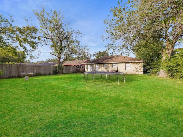 view of yard featuring a trampoline