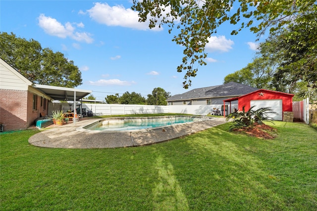 view of pool with a lawn and a patio