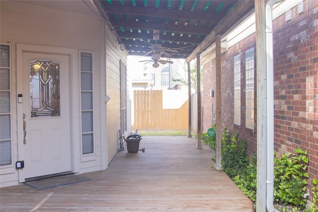 exterior space featuring ceiling fan and a wooden deck