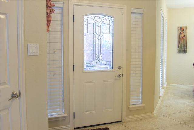 foyer with light tile patterned floors