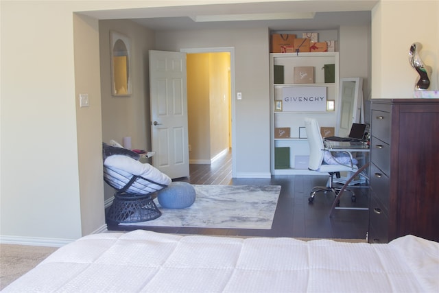 bedroom with wood-type flooring