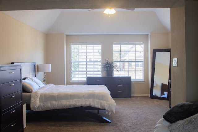 bedroom with vaulted ceiling, light carpet, and ceiling fan