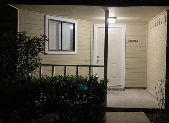 16703 Sentinel Dr, Houston, TX 77053 - doorway to property featuring a porch