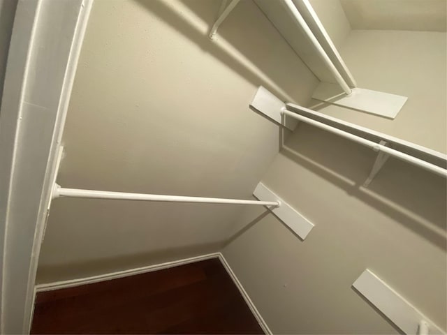 16703 Sentinel Dr, Houston, TX 77053 - walk in closet featuring wood finished floors