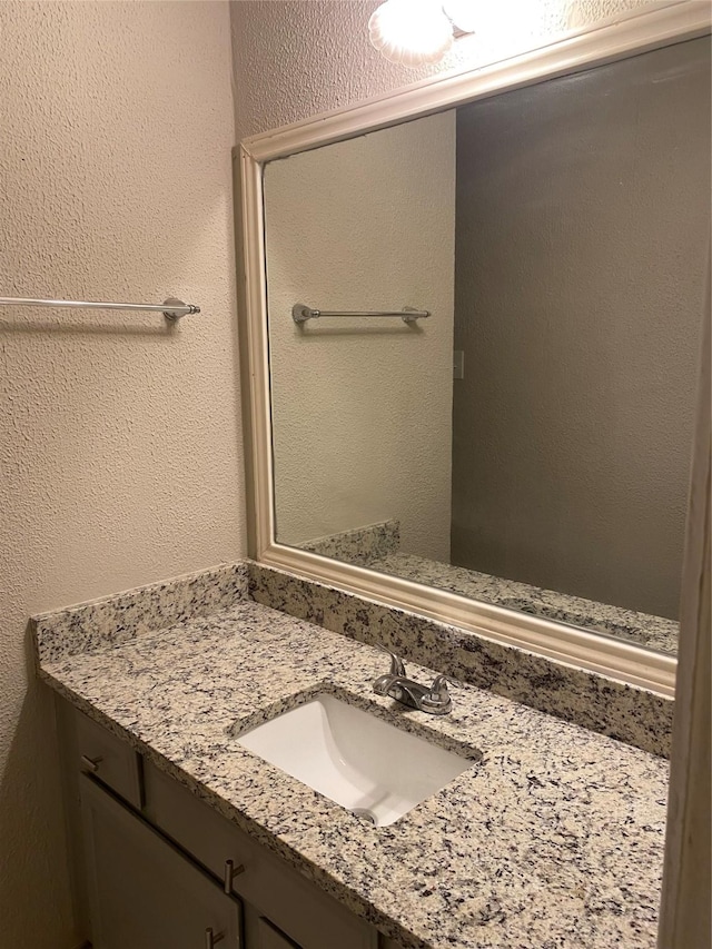 16703 Sentinel Dr, Houston, TX 77053 - bathroom featuring vanity and a textured wall
