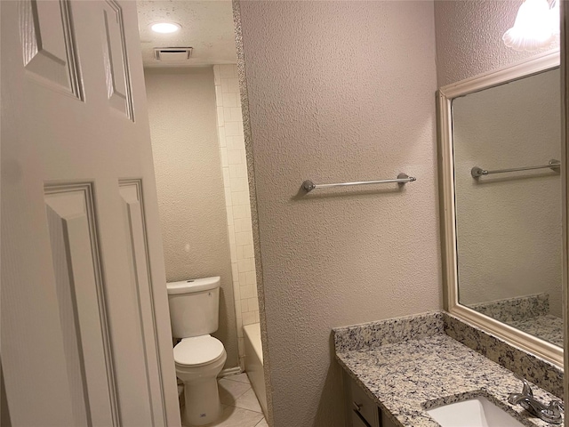 16703 Sentinel Dr, Houston, TX 77053 - bathroom featuring vanity, tile patterned floors, a textured wall, and shower / bathtub combination