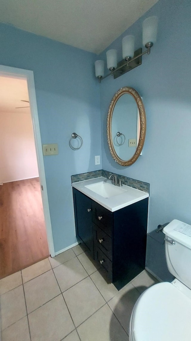 bathroom featuring hardwood / wood-style floors, vanity, and toilet