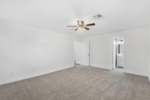 spare room with light colored carpet and ceiling fan