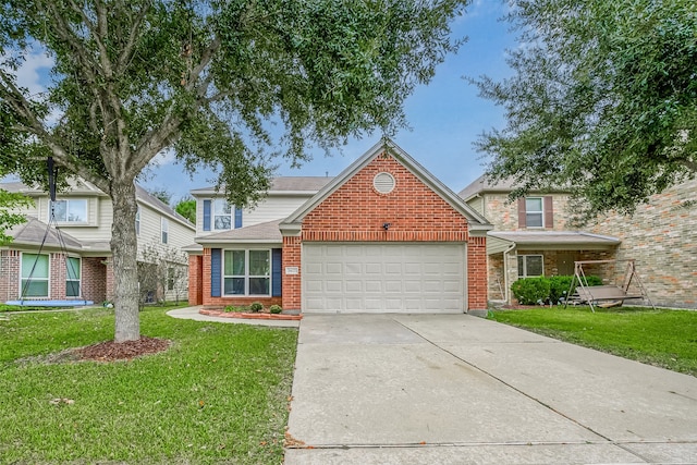 view of property featuring a garage and a front lawn