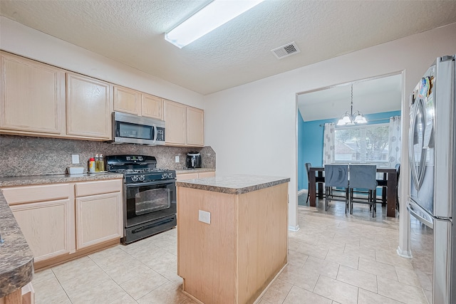 kitchen with stainless steel appliances, tasteful backsplash, light brown cabinets, an inviting chandelier, and a kitchen island