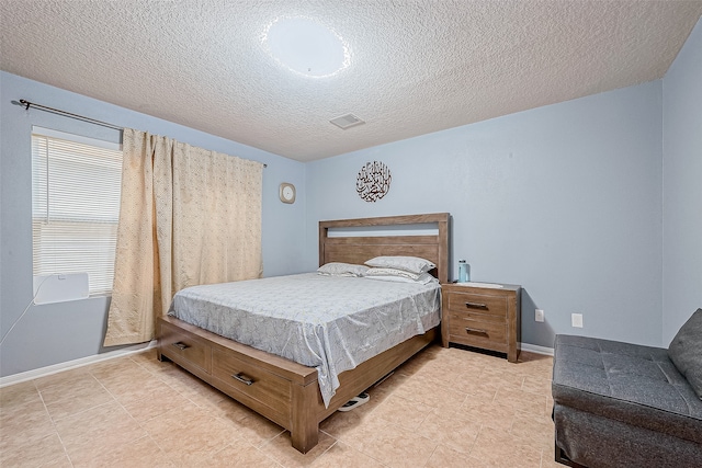 bedroom featuring a textured ceiling