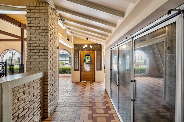 interior space featuring high vaulted ceiling and beamed ceiling