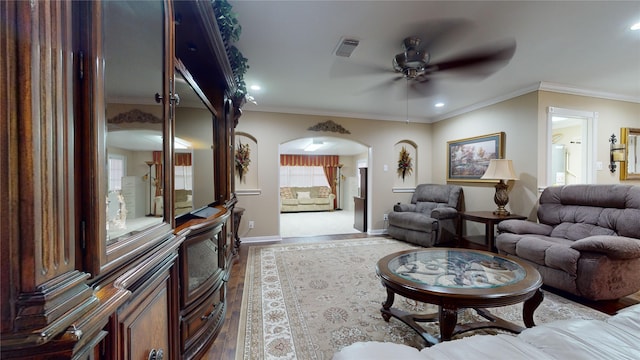 living room with ceiling fan, hardwood / wood-style floors, and ornamental molding