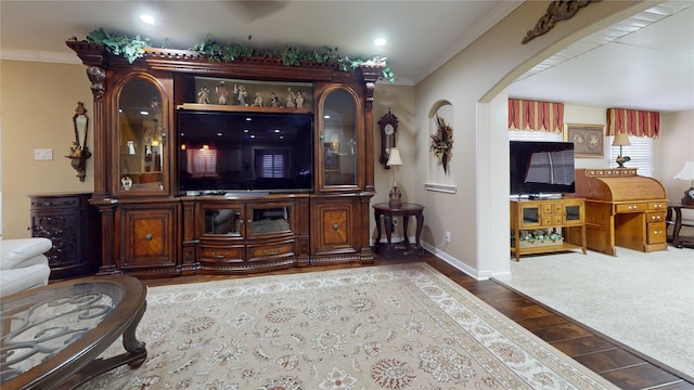 bar featuring ornamental molding and carpet