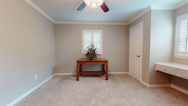 interior space featuring ceiling fan, light colored carpet, and ornamental molding