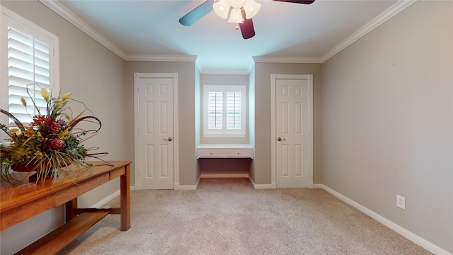 carpeted bedroom with ceiling fan and ornamental molding