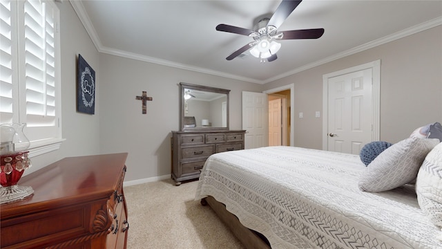 carpeted bedroom with ornamental molding and ceiling fan