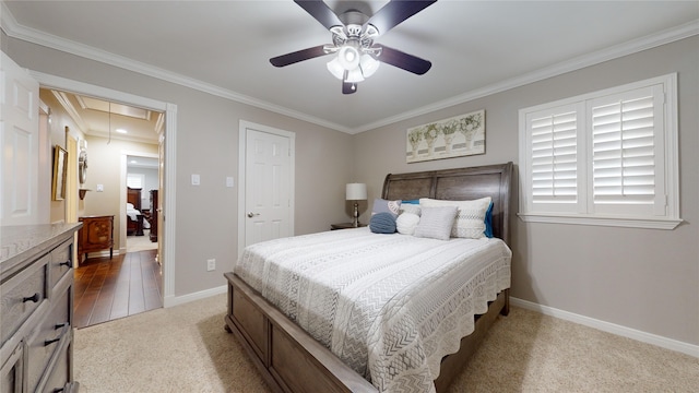 bedroom featuring ornamental molding, ceiling fan, and light hardwood / wood-style flooring